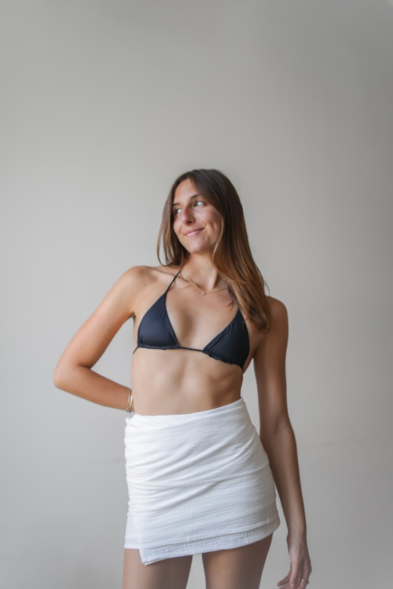 White Dune Towel worn as a sarong, made from organic cotton by Sal Paradise
